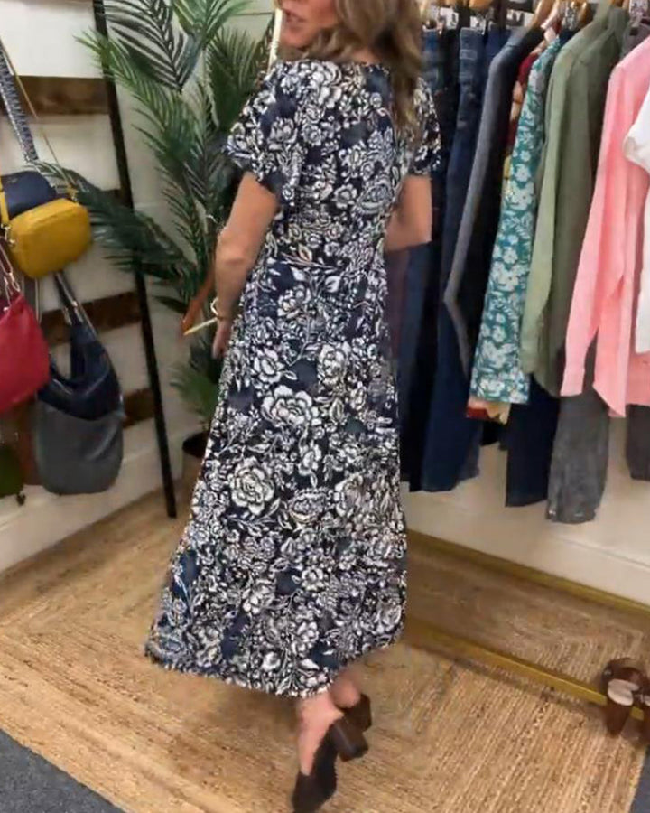 Emmas® | Lange jurk met korte mouwen en bloemenprint